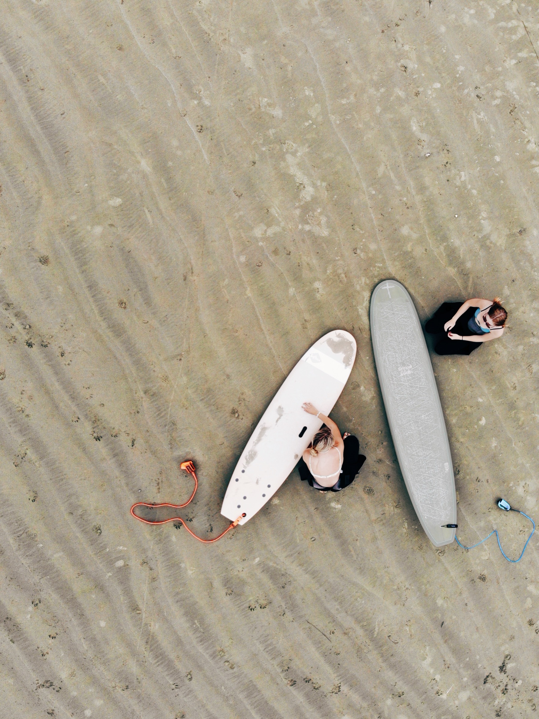 Aerial view of surfboards on sand