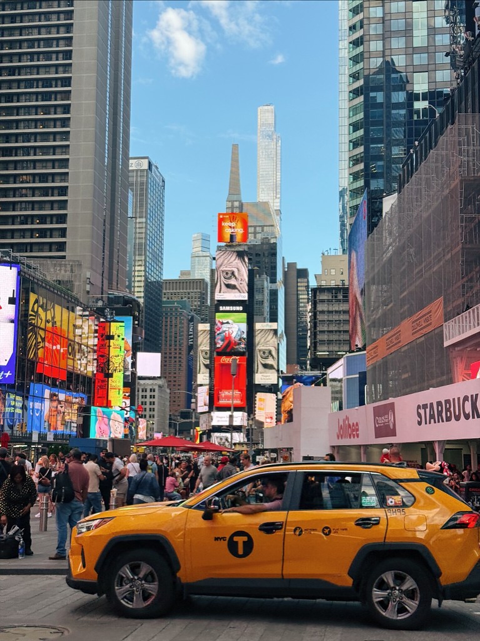 Yellow taxi on a Times Square street, New York