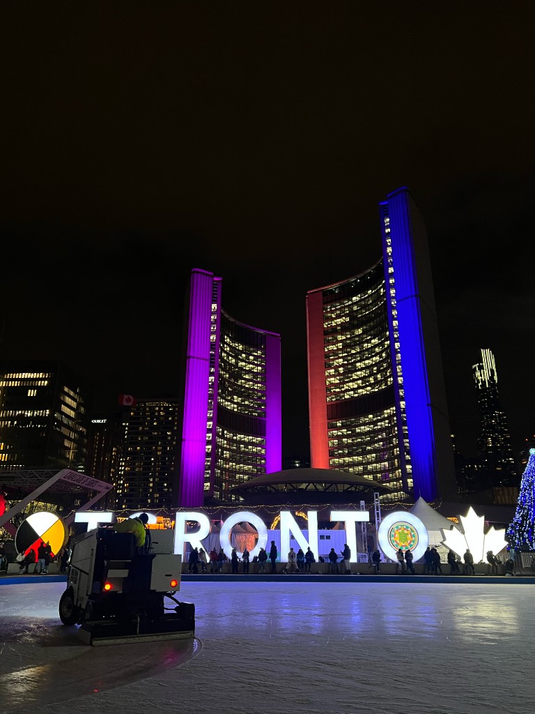 Toronto City Hall and the Nathan Phillips Square rink at night